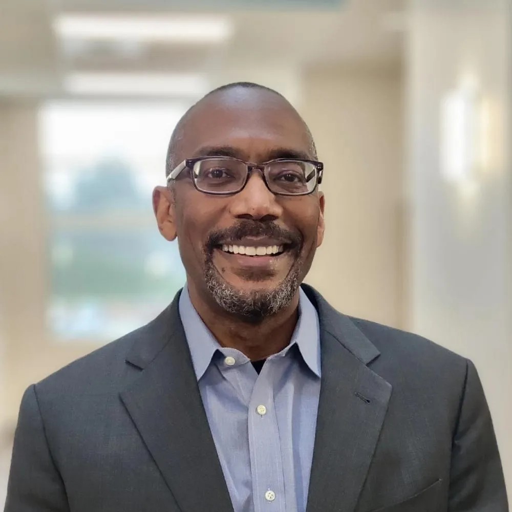 Dr. Milan Moore
